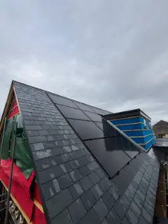 In-roof solar panels beside the dormer