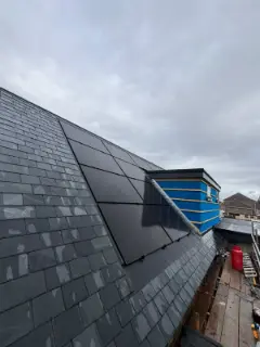 Solar panels flush with the new slate roof