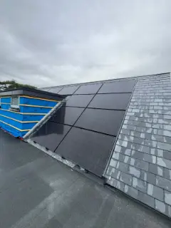 Solar panels, slate roof and flat roof finished